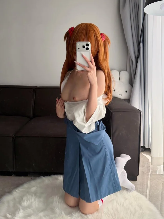 Asuka Evangelion Cosplay Nude Tease with Retro Gamer Vibes