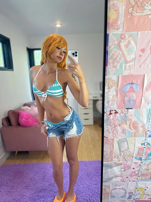 Nami One Piece cosplay nude by Lucycosplay in glasses