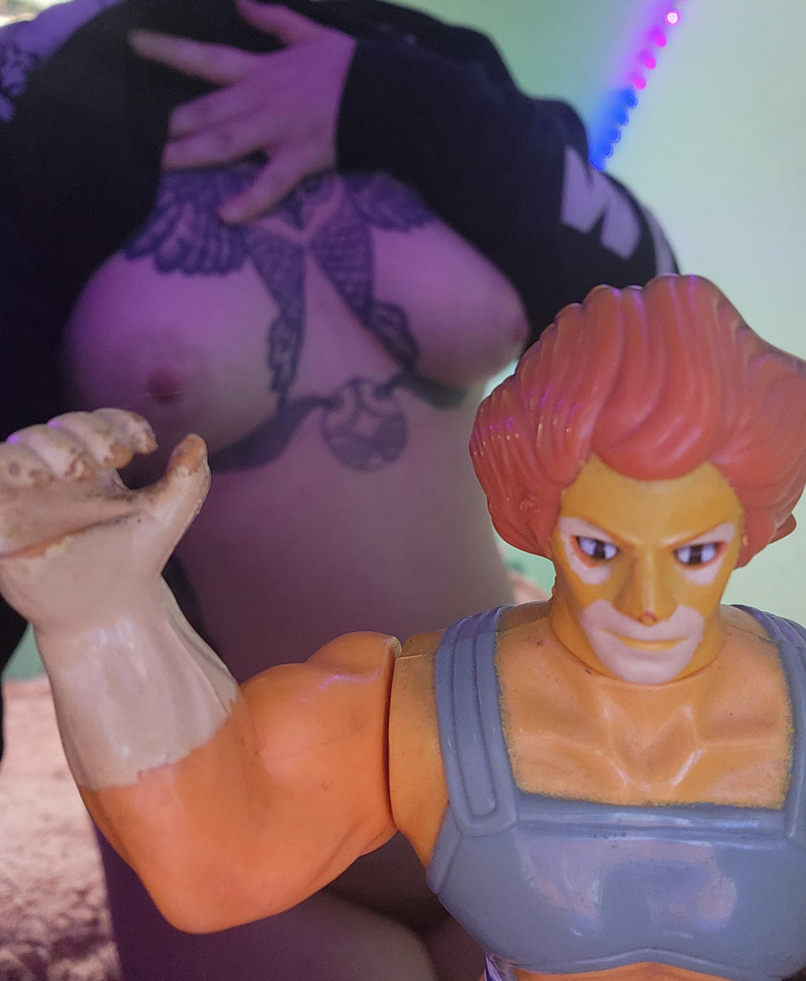 [F] I tried to get a funny shot of Lion-O playing with my titty but this is as close as I could get